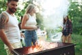 Group of friends making barbecue in the backyard. concept about good and positive mood with friends Royalty Free Stock Photo