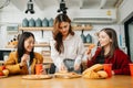 Group of friends making fun at home party.They sitting on desk in living room and eating pizza. happy Royalty Free Stock Photo