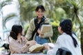 Group of friends meet in the park in university. People having breaking time outdoor. young woman greet college