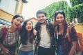 Group of friends meeting in the city. Having fun together talking selfie smiling enjoy good times Royalty Free Stock Photo