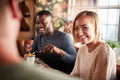 Group Of Friends Meeting For Meal In Traditional English Pub Royalty Free Stock Photo