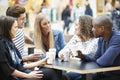 Group Of Friends Meeting In Shopping Mall CafÃÂ½ Royalty Free Stock Photo