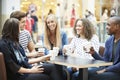 Group Of Friends Meeting In Shopping Mall CafÃÂ½ Royalty Free Stock Photo