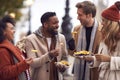 Group Of Friends Outdoors Wearing Coats And Scarves Eating Takeaway Fries In Autumn London Royalty Free Stock Photo