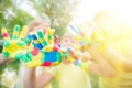 Group of friends with painted hands Royalty Free Stock Photo