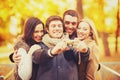 Group of friends with photo camera in autumn park Royalty Free Stock Photo