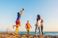 Group of friends enjoy on the beach