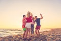 Group of friends enjoy on the beach