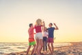 Group of friends enjoy on the beach