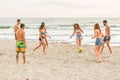 Group of friends playing with ball on the beach Royalty Free Stock Photo