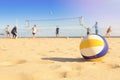 Group of friends playing beach volleyball