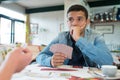 group friends playing cards together Royalty Free Stock Photo