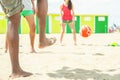 Group of friends playing soccer in copacabana beach game in Brazil - Diverse ethnic people having fun in football match on the Royalty Free Stock Photo