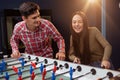 Group of friends playing table soccer at beer pub Royalty Free Stock Photo