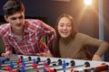 Group of friends playing table soccer at beer pub Royalty Free Stock Photo