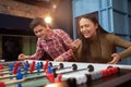 Group of friends playing table soccer at beer pub Royalty Free Stock Photo