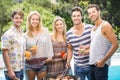 Group of friends preparing barbecue near pool Royalty Free Stock Photo