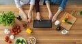 Hands Preparing Healthy Meal with Fresh Ingredients and Digital Tablet Royalty Free Stock Photo