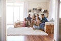 Group Of Friends Relaxing At Home Watching TV Together Royalty Free Stock Photo