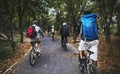 Friends ride mountain bike in the forest