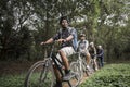 Group of friends ride mountain bike in the forest together Royalty Free Stock Photo