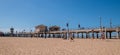 Group of friends are seen playing volleyball next to the Huntington Beach Pier Royalty Free Stock Photo