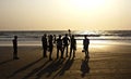 A group of friends silhouetted at Arambol Beach, North Goa Royalty Free Stock Photo