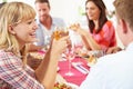 Group Of Friends Sitting Around Table Having Dinner Party Royalty Free Stock Photo