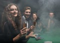 Group of friends sitting at game table in casino Royalty Free Stock Photo