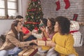 Friends exchanging Christmas presents Royalty Free Stock Photo