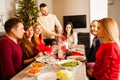 Group of friends sitting on the table at the Christmas Royalty Free Stock Photo