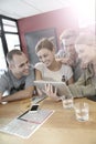 Group of friends in a snack bar websurfing