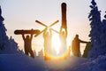 Group of friends snowboarders having fun on the top of mountain