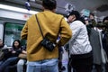 Young people in crowded subway train in Shenzhen