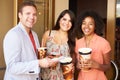 Group Of Friends Standing Outside Cinema Together Royalty Free Stock Photo