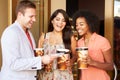 Group Of Friends Standing Outside Cinema Together Royalty Free Stock Photo