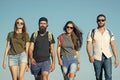 Group of friends on summer vacation. Happy friends on blue sky, wanderlust. Friendship, friends, young people, youth Royalty Free Stock Photo