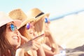 Group of friends sunbathing on the beach Royalty Free Stock Photo