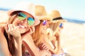 Group of friends sunbathing on the beach Royalty Free Stock Photo