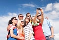 Group of friends taking picture with smartphone Royalty Free Stock Photo