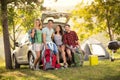 Group of friends taking selfie with smartphone on camping trip Royalty Free Stock Photo