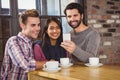 Group of friends taking selfies with a smartphone Royalty Free Stock Photo