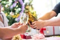 Group of Friends toasting drinks. Close-ups hands of friends toasting wine glass and beers in the dinner party for celebrating