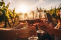 Group of friends toasting wine glasses in vineyard at sunset, close-up, Blurred image of friends toasting wine in a vineyard in