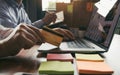 Group of friends are together looking at products on a laptop computer and using credit cards for online shopping Royalty Free Stock Photo