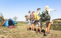 Group of friends trekking at trip camp on italian hills on sunny