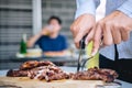 Group of friends Two young man enjoying grilled meat and raise a glass of beer to celebrate the holiday festival happy drinking Royalty Free Stock Photo