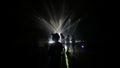 Group of friends under stage lights during a show at sonar festival in barcelona