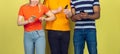 Group of friends using mobile smartphones. Teenagers addiction to new technology trends. Close up. Royalty Free Stock Photo
