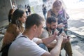 Group of friends using smartphones. Emotional isolation and technology depresion Royalty Free Stock Photo